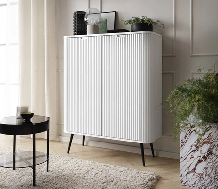 Zoya 103 cm Kommode weiß elegantes Design ovale Form auf schwarzen Metallbeinen geschmackvolle geriffelte Front gesetzt